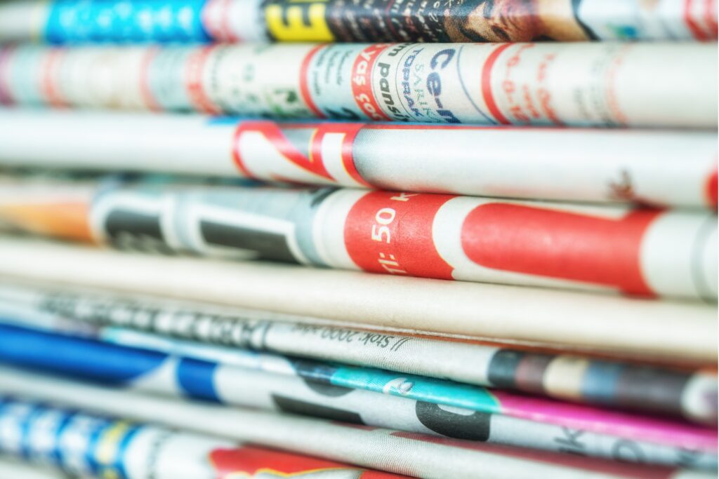Image of newspapers in a stack to represent Rectifi press coverage